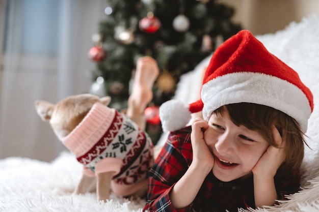 Happy Little child and dog at Christmas