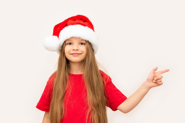 A happy little girl points her finger to the side