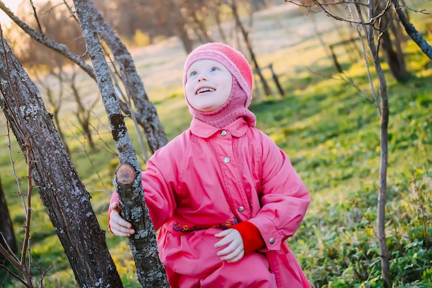 Happy little girl in the spring garden