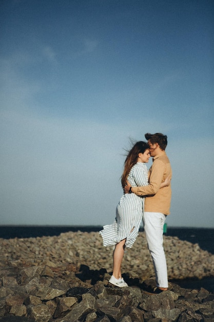 Happy loving couple on a lake beach