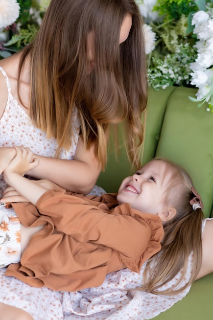 Happy loving family Mother and her daughter girl play and have fun The pleasure of being a mom mother39s day greetings the concept of a sweet moment together