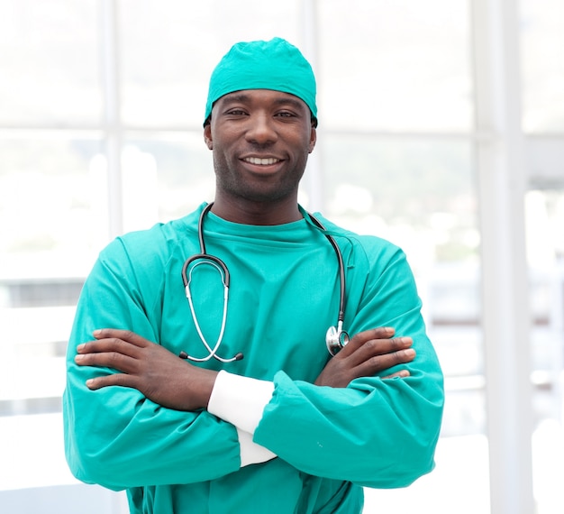 Happy male doctor looking at the camera