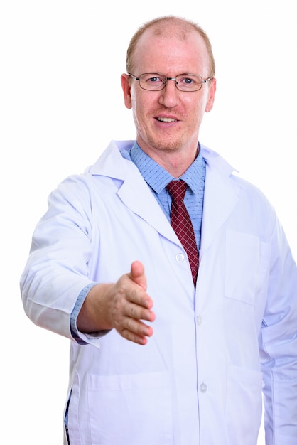 happy man doctor smiling while giving handshake isolated on white