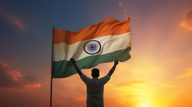 Happy man holding Indian flag in the sunset sky freedom and patriotism concept