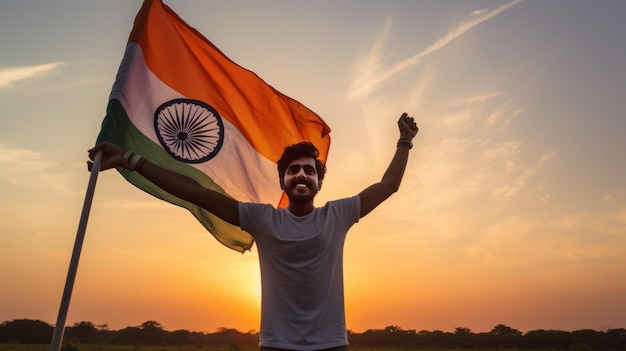 Happy man holding Indian flag in the sunset sky freedom and patriotism concept