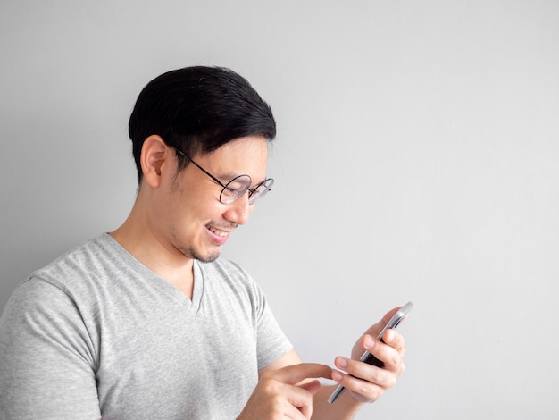 Happy man is using smartphone