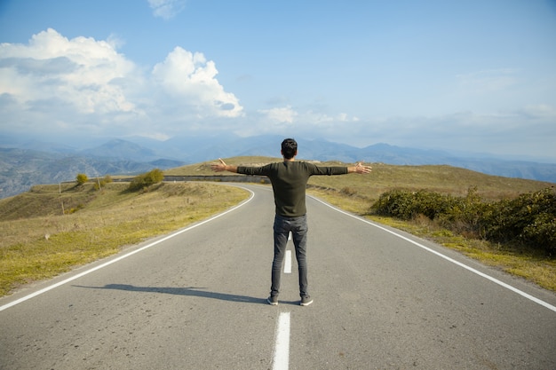 Happy man in  road under sky