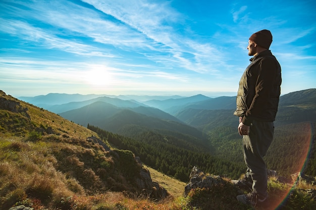 The happy man standing on the rock