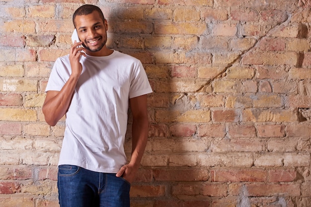 Happy man talking on the phone