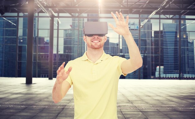 Photo happy man in virtual reality headset or 3d glasses