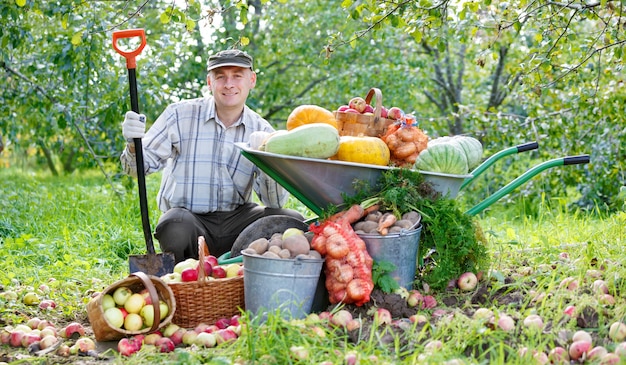 Happy man with a crop in the garden