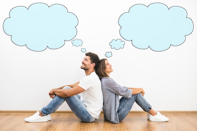 The happy man and woman dream near the wall with a bubbles