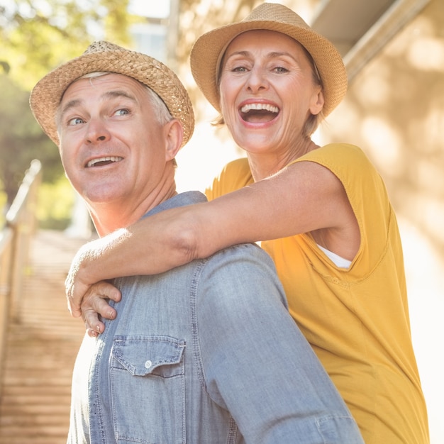 Happy mature couple having fun in the city