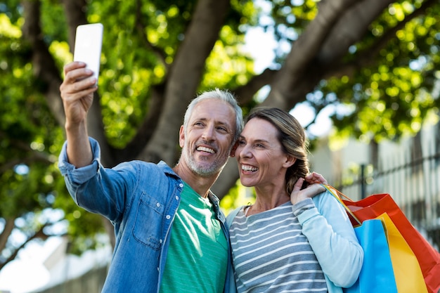 Happy mature couple taking selfie