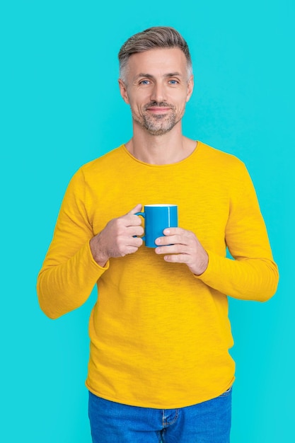 Happy mature man at coffee break on background photo of mature man at coffee break