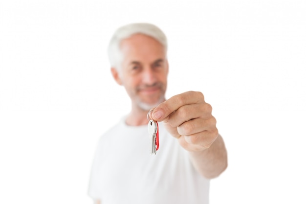 Happy mature man holding new house key