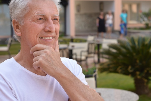 Happy Mature man on vacation thinking and smiling