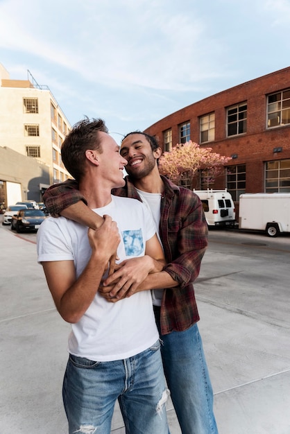 Happy men hugging medium shot