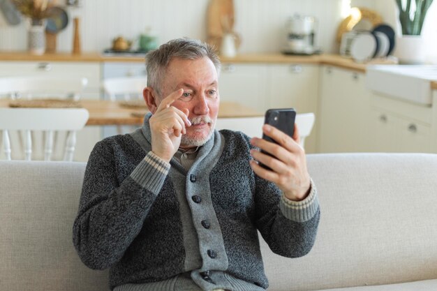 Happy middle aged senior man talk on video call with friends family laughing mature old senior grand