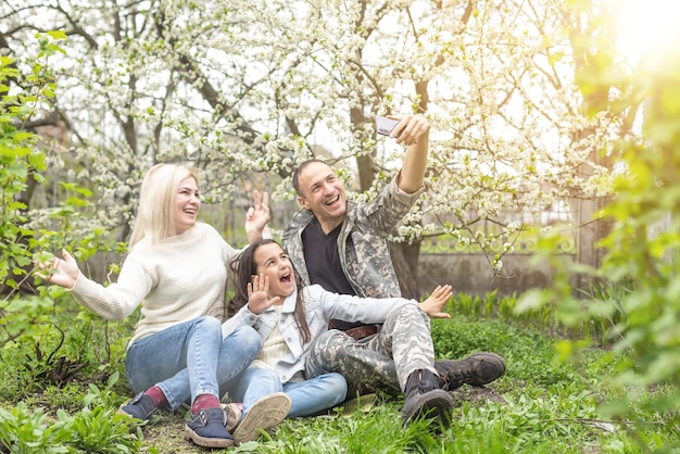 happy military family relaxing in the garden.