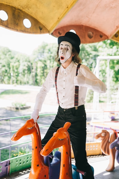 Happy mime in a carousel