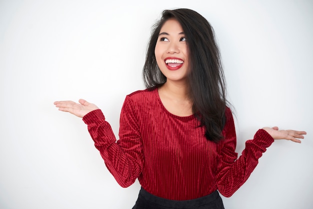 Happy model in red velvet blouse