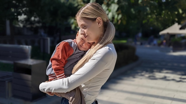 happy mother with a baby boy in her arms