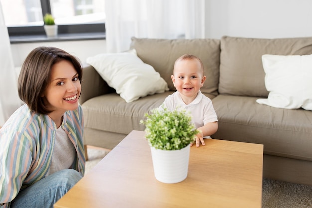 happy mother with little baby boy at home