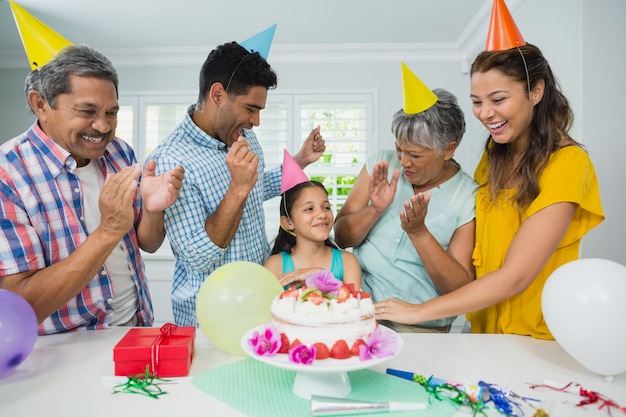 Happy multigeneration family celebrating birthday party