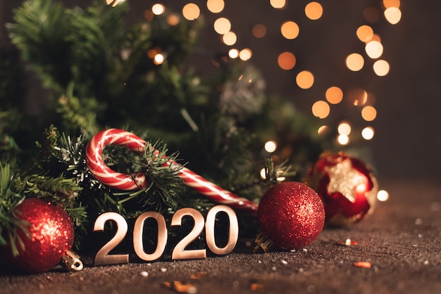 Happy New Year 2020. Symbol from number 2020 on wooden background