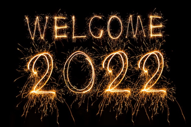 Happy New Year 2022 Sparkling burning text Happy New Year 2022 isolated on black background Beauti