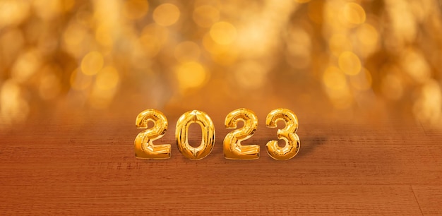 Happy new year 2023 Golden numbers on a shiny background New Year's banner