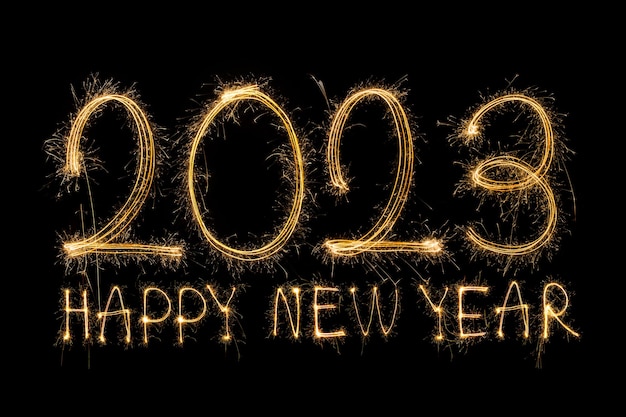 Happy New Year 2023. Sparkling burning text Happy New Year 2023 isolated on black background. Beauti