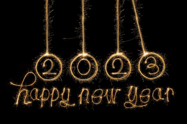 Happy New Year 2023. Sparkling burning text Happy New Year 2023 isolated on black background. Beauti