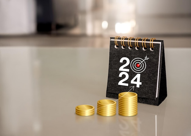 Happy new year 2024 banner background Gold coin stacked as a graph with rise arrow and 2024 numbers with target icon on black small desk calendar stand on table Business goals and success concepts