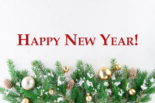 Happy New Year card with fir branches and golden balls