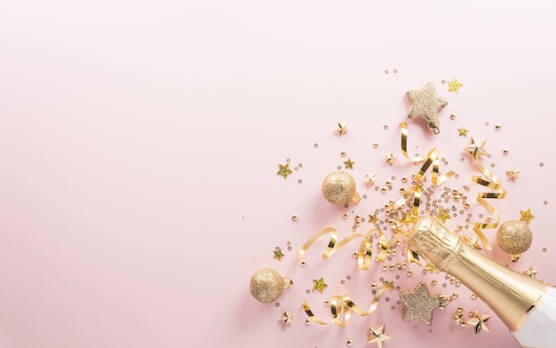 Happy New year celebration background concept Champagne bottle golden ribbon stars and christmas ball on pastel background