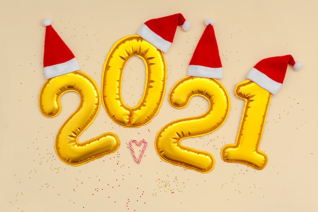 Happy New Year Golden digits 2021 numbers with Christmas hat