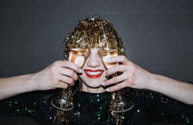 Happy new year new year eve party celebration beautiful woman with holiday makeup and gold shiny