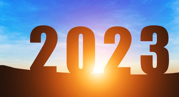 Happy New Year Numbers 2023 Silhouette the hill early morning sunrise over the horizon background Happy new year concept