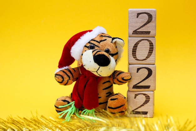 Happy New Year Toy tiger and blocks with numbers 2022