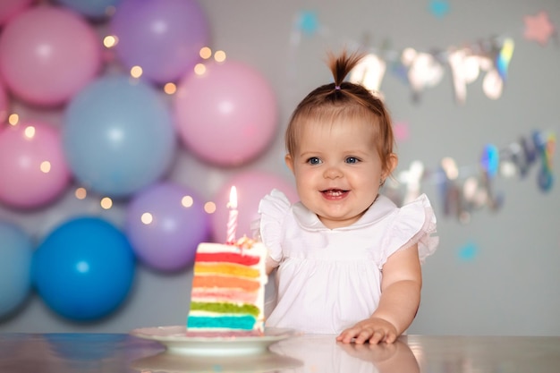 Happy one year old child with a birthday cake Childs birthday