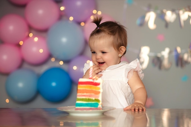 Happy one year old child with a birthday cake Childs birthday