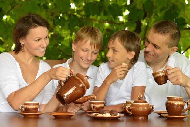 Happy parents with their children in the summer