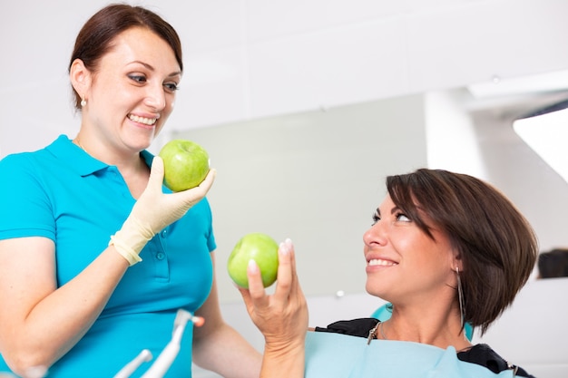 A happy patient eating an apple