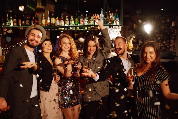 Happy people celebrating winter holiday together with champagne Party celebration concept