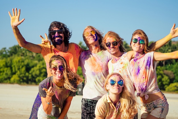 Happy people taking self portraits on smartphone in India Goa fest