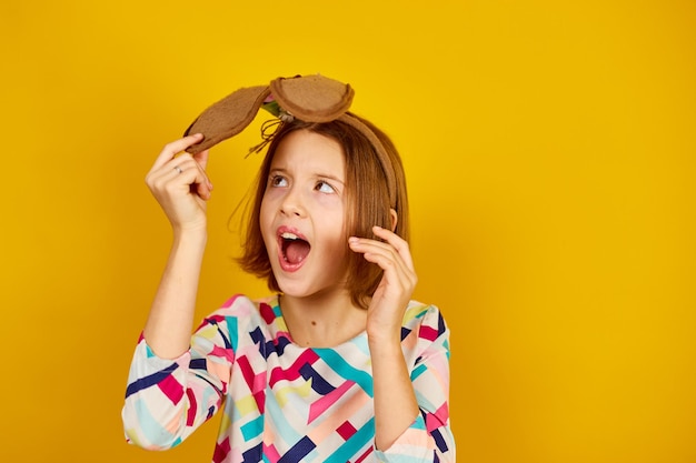 Happy playful teenager girl wearing bunny ears