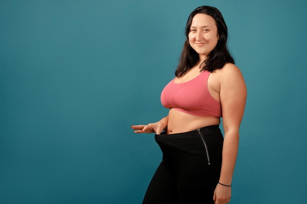 Happy plus size positive woman. Happy body positive concept. I love my body. Attractive overweight woman posing on camera. Before and after from fat to slim concept