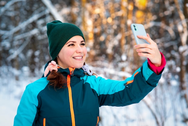 Happy positive young woman taking selfie